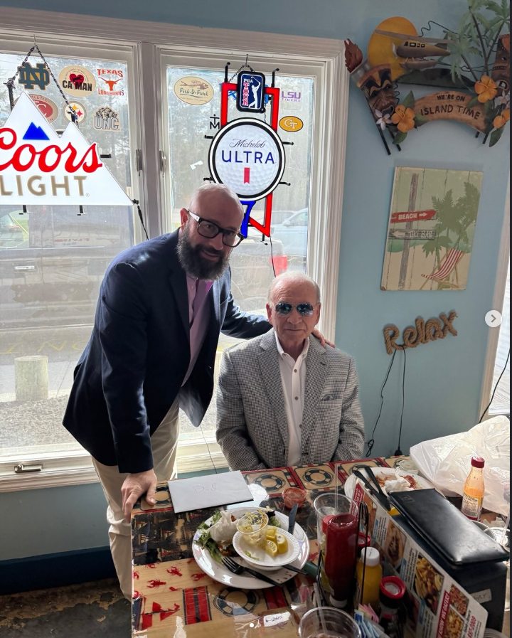 Client testimonial image for Pull Your Part Accelerator showing two business partners at a local auto parts location, highlighting proven results for salvage yard growth.
